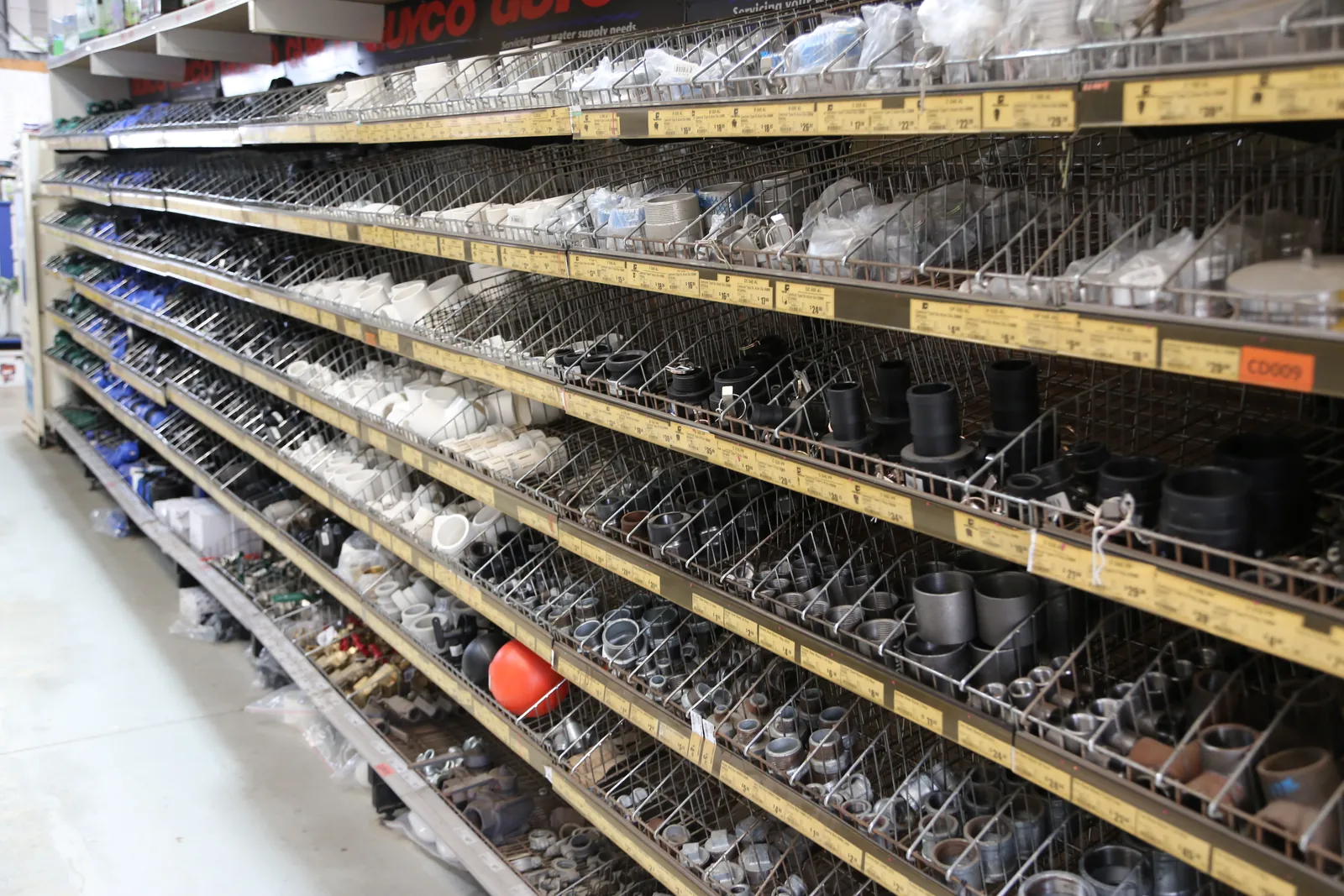 Plumbing fittings aisle — PVC, poly, galvanised and brass fittings at Miller's Mitre 10 Narangba